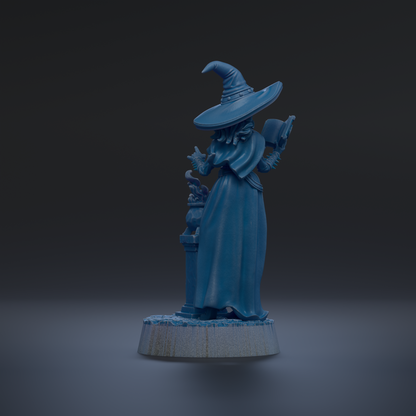 A blue statue of a wizard holding a book and a cauldron, standing on a pedestal against a dark background.