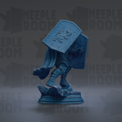 A blue statue of a knight holding a shield and sword, standing on a pedestal.