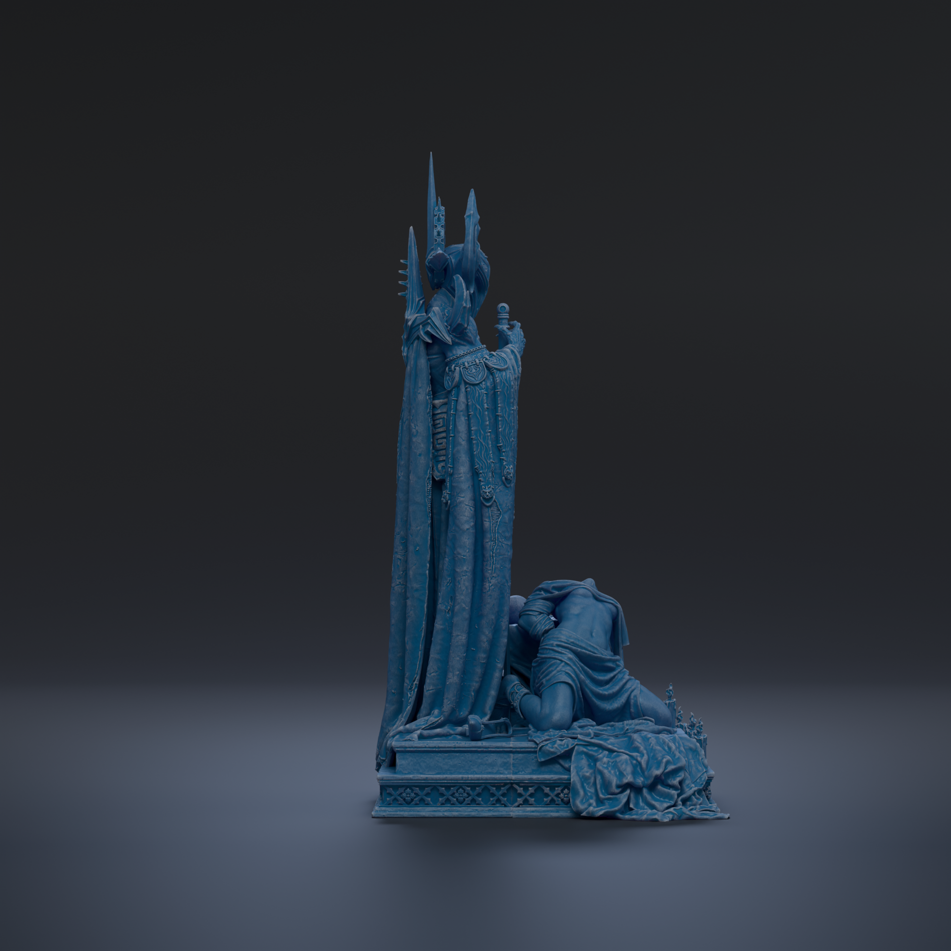 A dark blue statue of a figure standing on a pedestal, with a smaller figure kneeling in front of it.