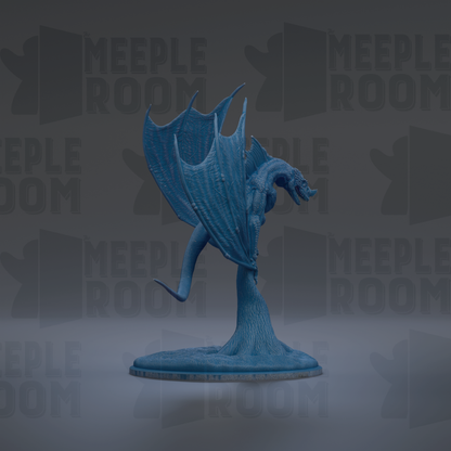 A blue dragon figurine with wings spread, standing on a base.