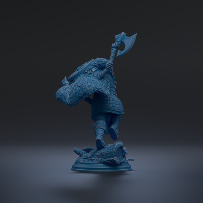 A blue figurine of a warrior wielding a large weapon, standing on a base and holding a shield.