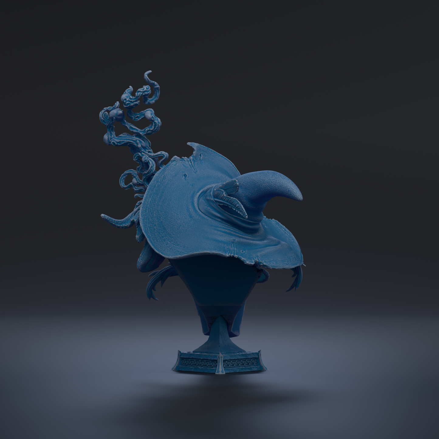 A blue, sculpted object resembling a hat or a trophy, with a pointed top and a curved shape, against a dark background.