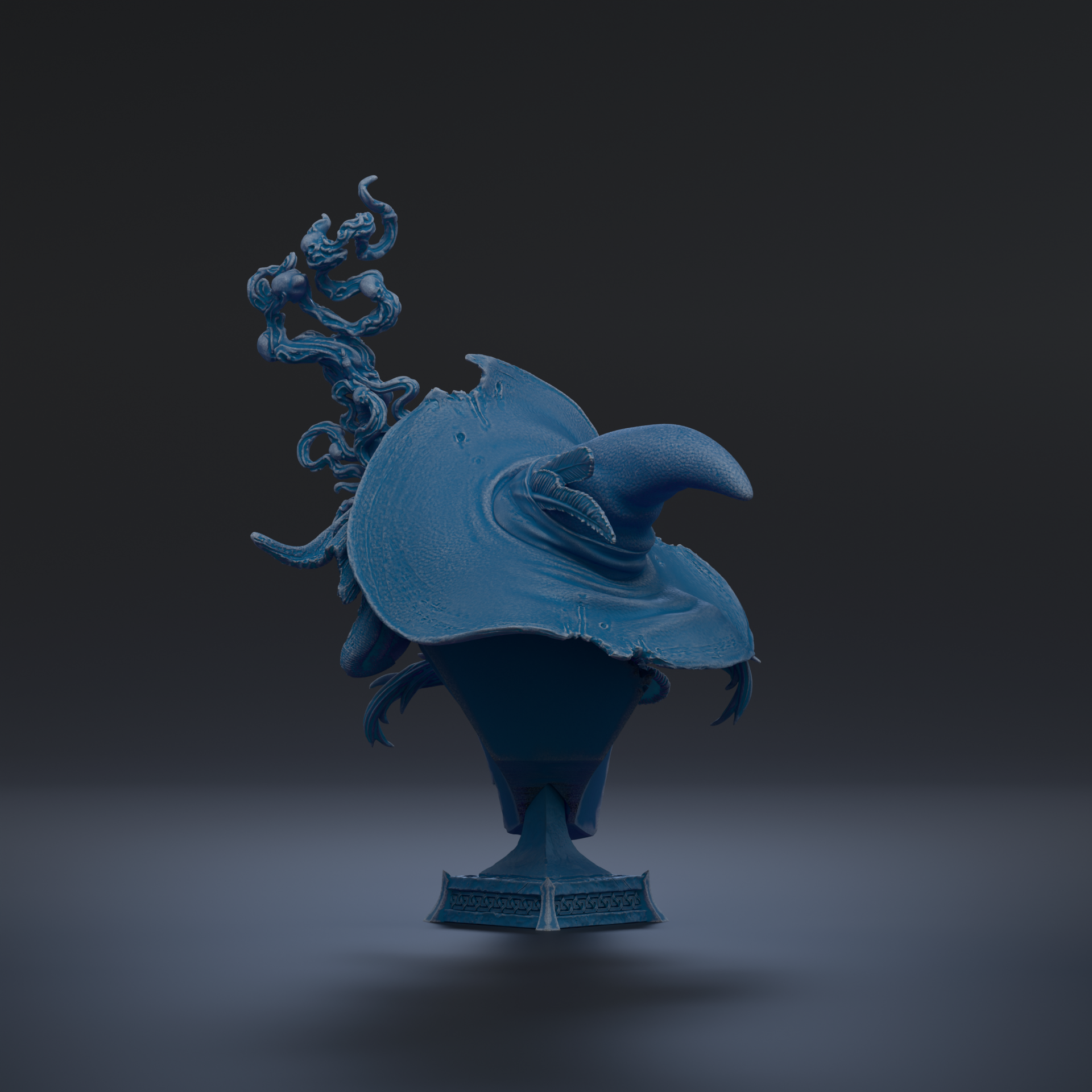A blue, sculpted object resembling a hat or a trophy, with a pointed top and a curved shape, against a dark background.