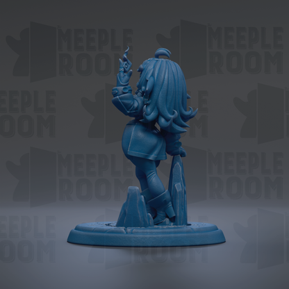 A blue figurine of a person with long hair and a flowing skirt, standing on a base and holding a small object in their hand.