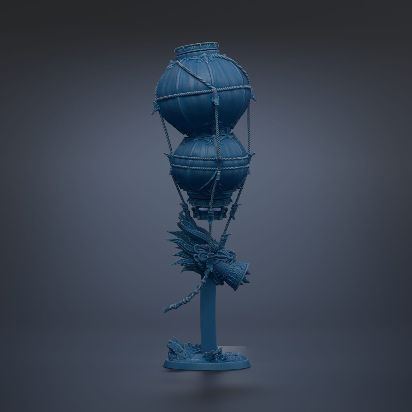 A blue, spherical object with a dragon-like design on it, standing on a base and appearing to be suspended in mid-air.