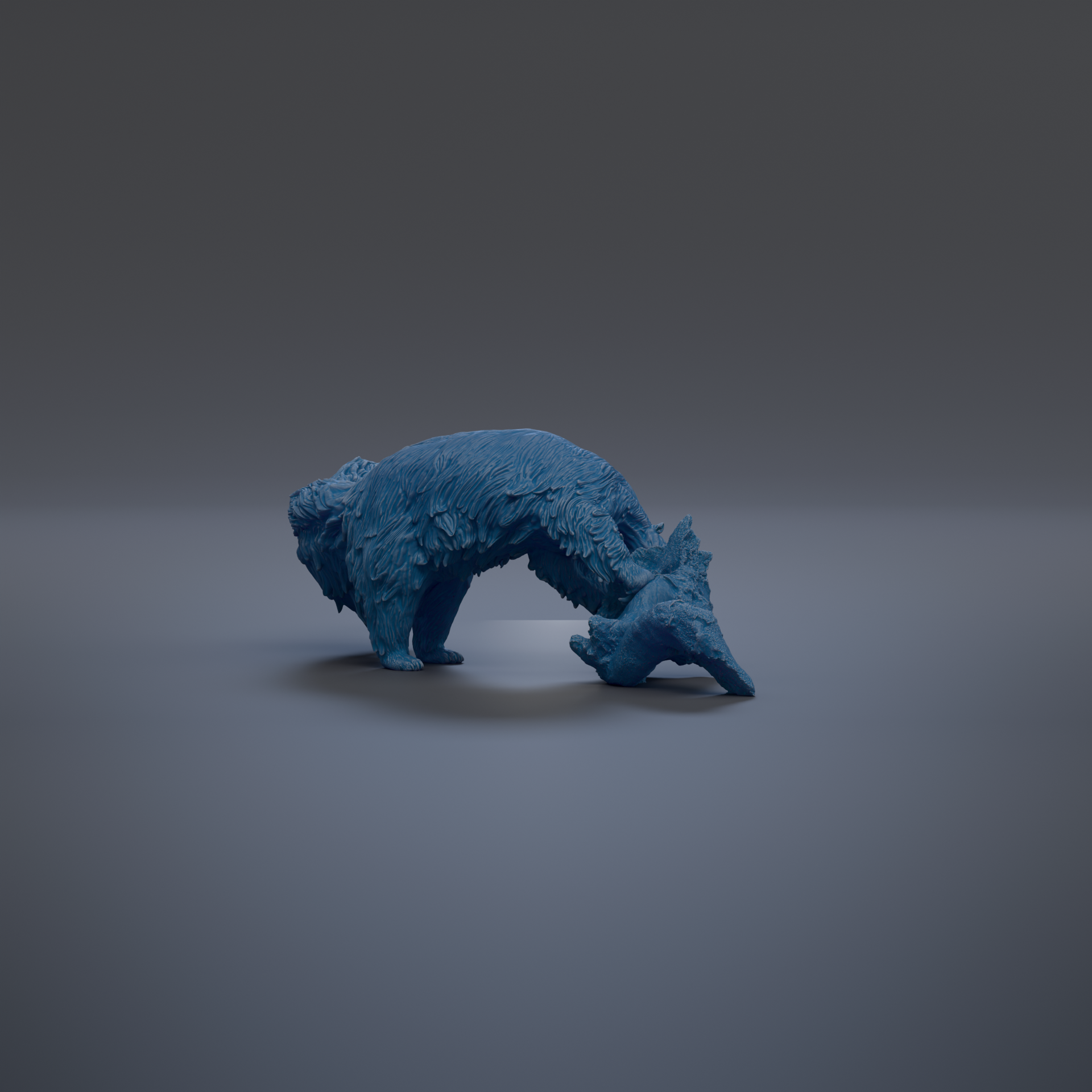 A blue, furry animal figurine is shown in a crouched position against a dark background.