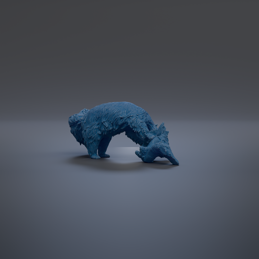 A blue, furry animal figurine is shown in a crouched position against a dark background.