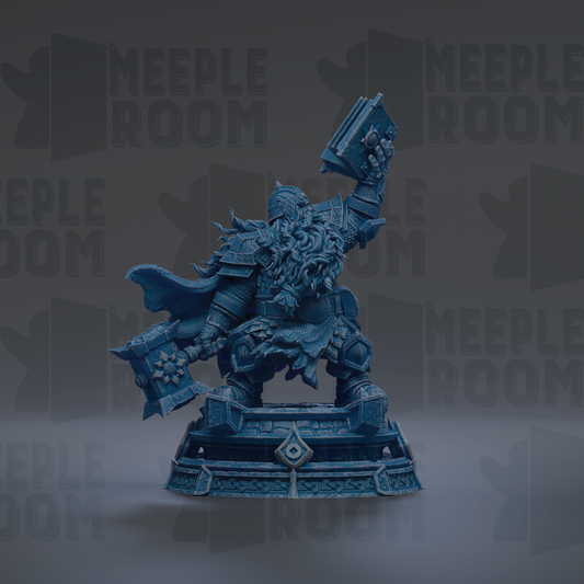 A blue statue of a warrior figure holding a shield and sword, standing on a pedestal.