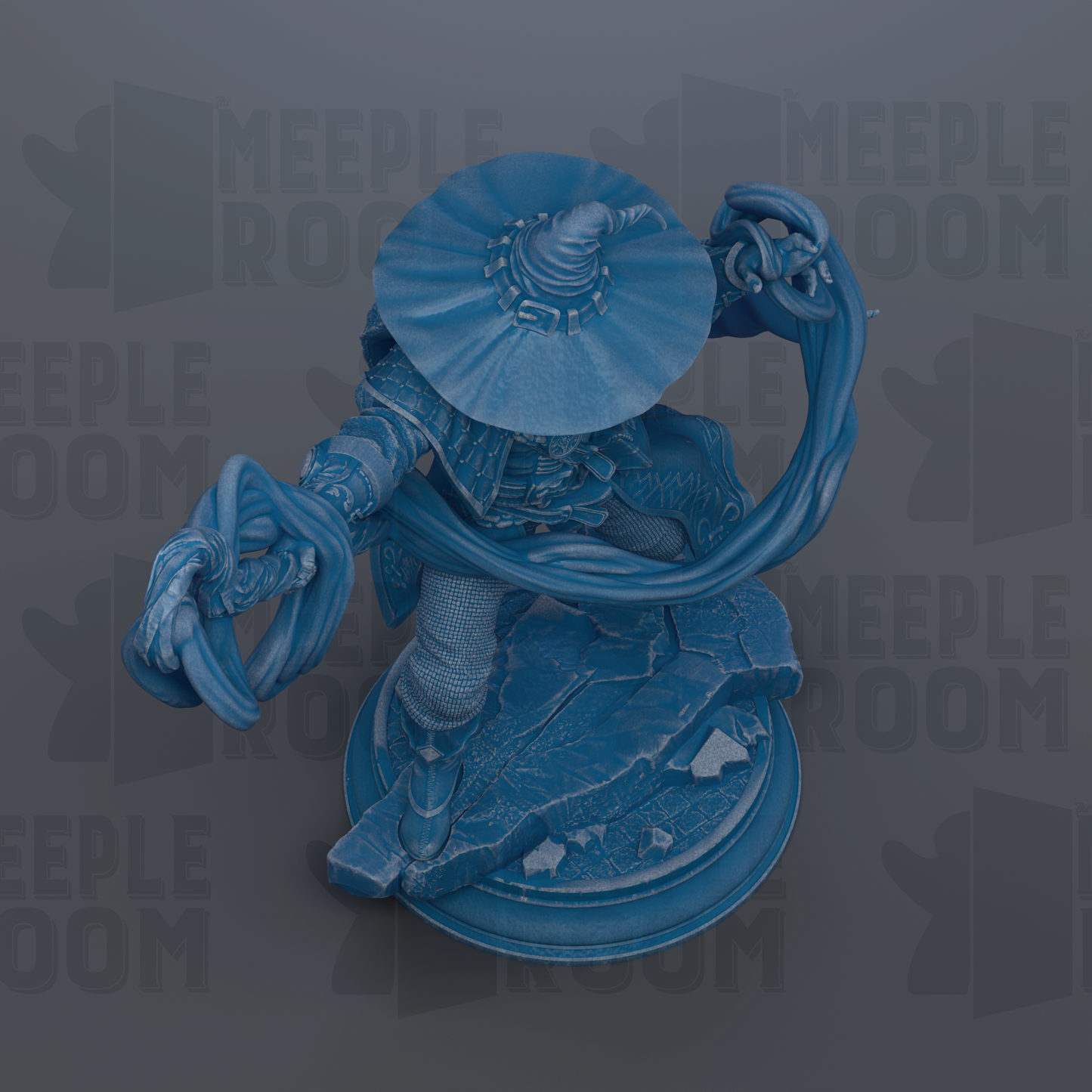 A blue figurine of a character with a large hat and a flowing cape, standing on a platform.