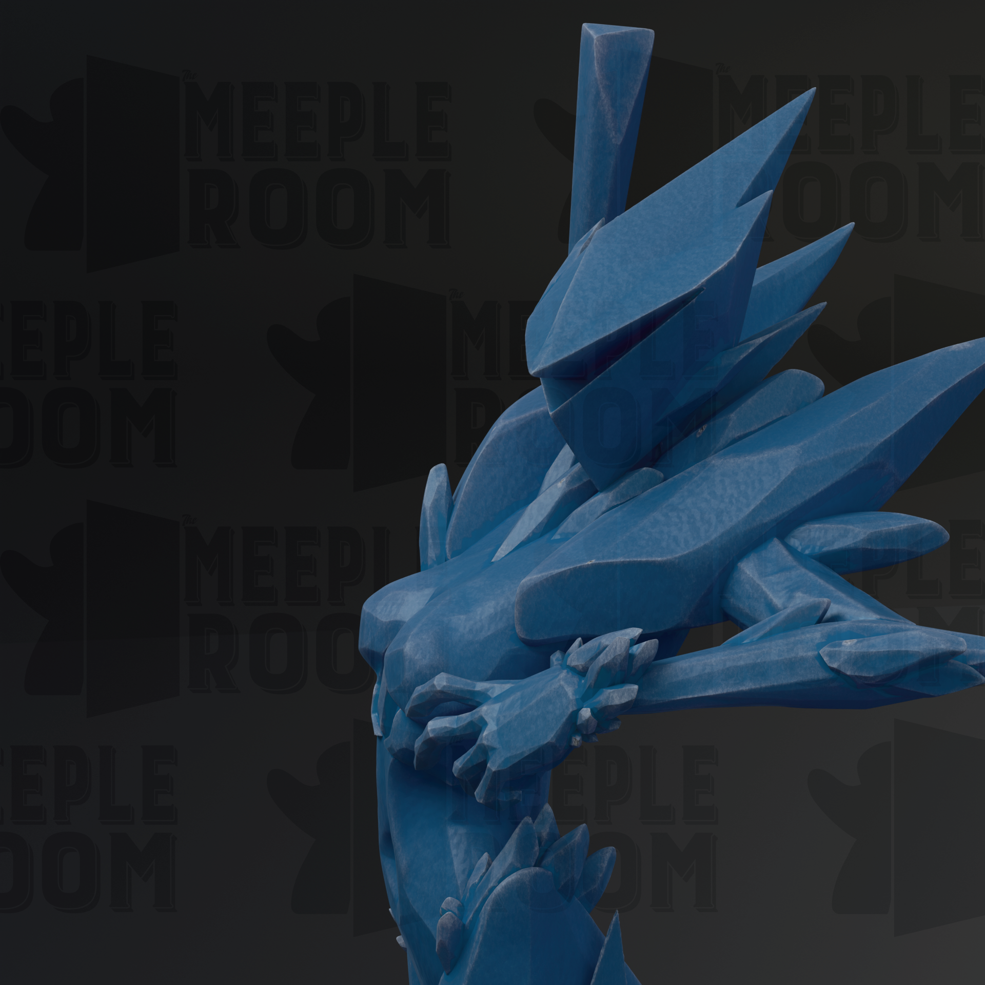 A close-up view of a blue, abstract sculpture with sharp, angular edges and a textured surface.