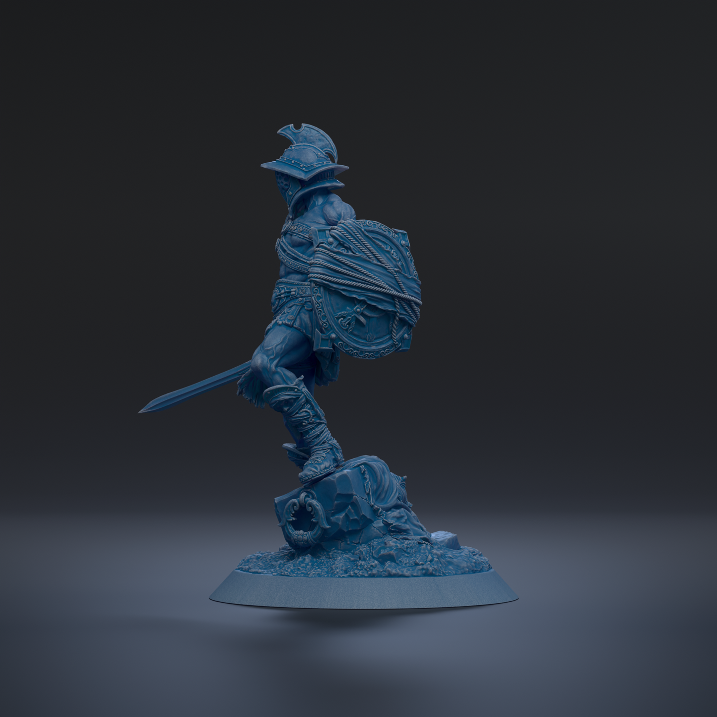 A blue figurine of a warrior standing on a base, holding a shield and sword.