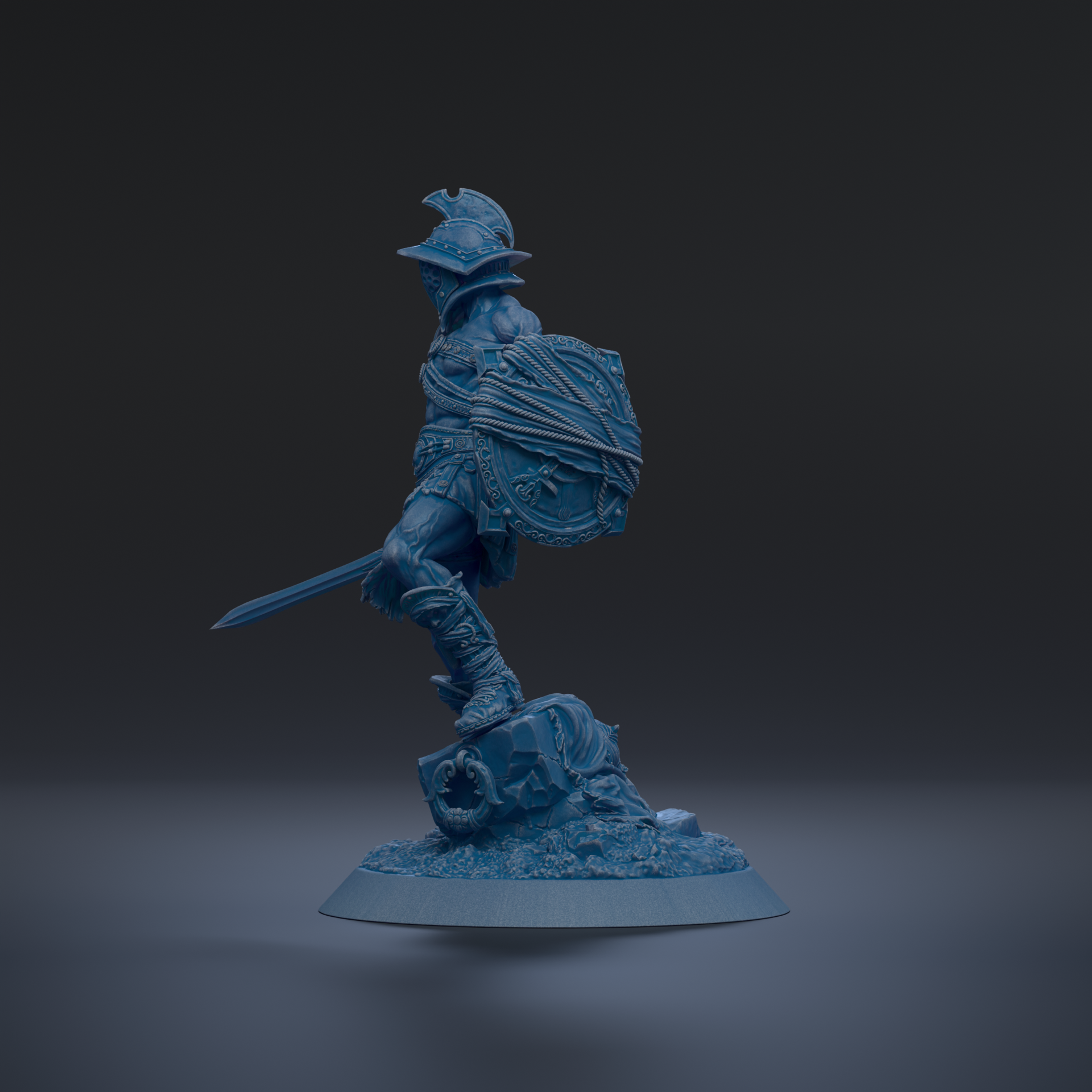 A blue figurine of a warrior standing on a base, holding a shield and sword.