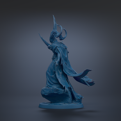 A blue statue of a figure with horns and a flowing cape, standing on a rock.