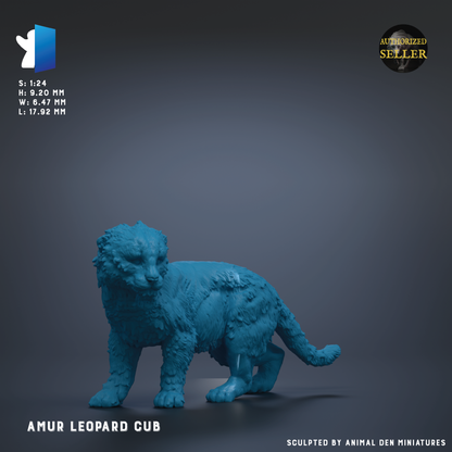 a blue figurine of a leopard cub, which is a small, toy-like representation of a real leopard cub.