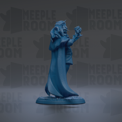 A blue statue of a figure with a long cape and a crown, standing on a base and holding a shield.
