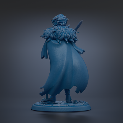 A blue figurine of a person wearing a fur-trimmed cape and holding a sword stands on a base against a dark background.