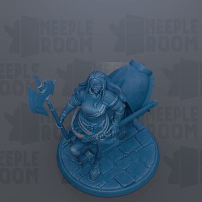 A blue figurine of a female warrior, holding a sword and shield, is depicted in the image.