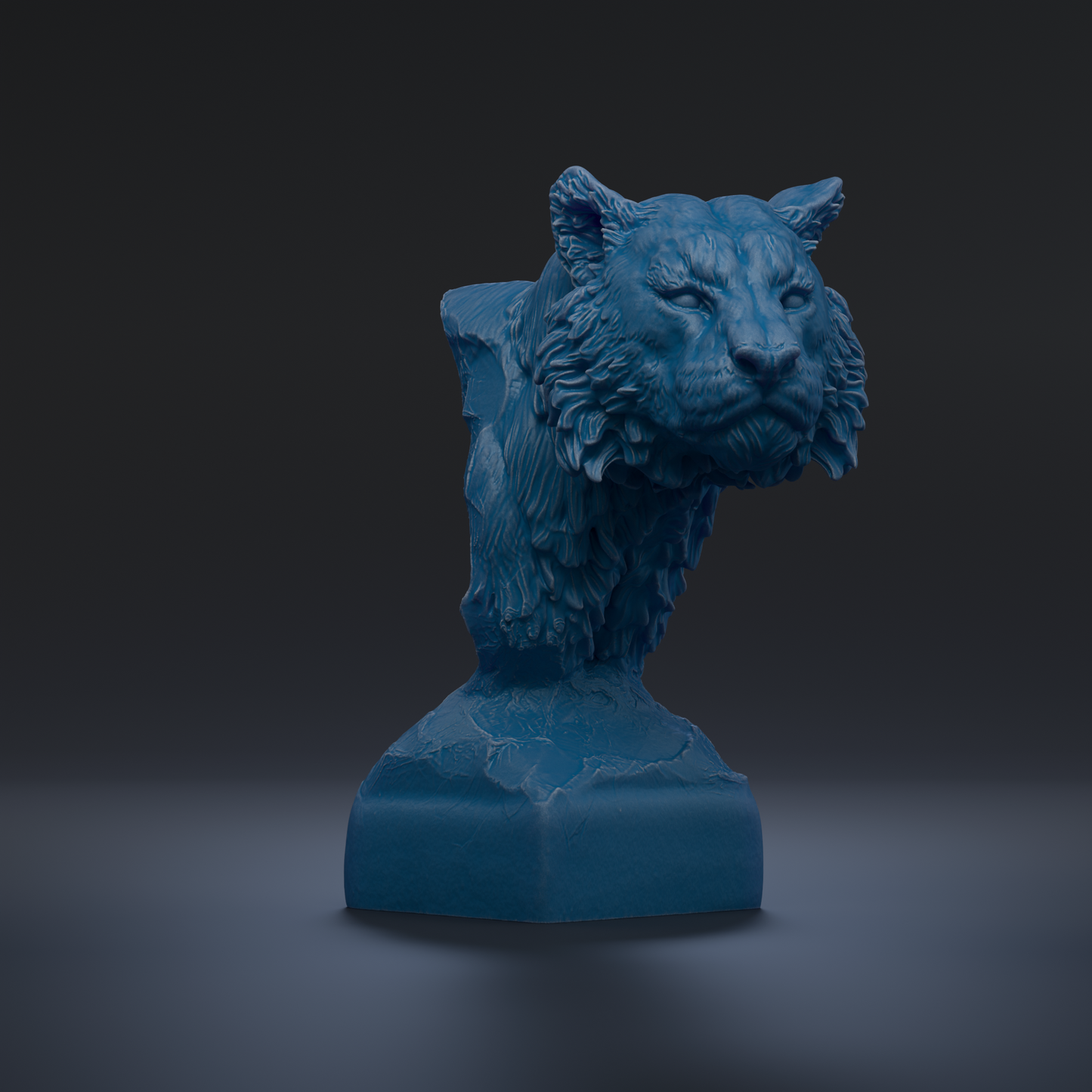 A blue, sculpted statue of a tiger's head is displayed against a dark background.