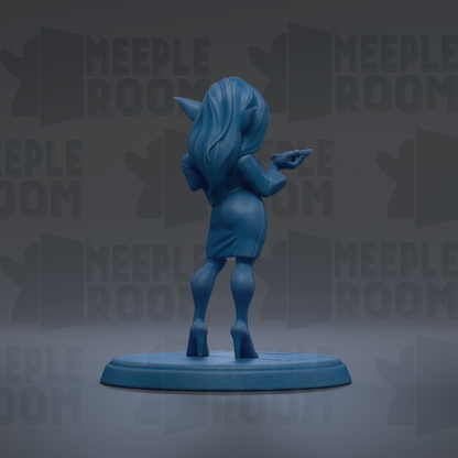 A blue figurine of a woman with long hair and a dress is standing on a blue base, facing away from the camera.