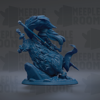 A blue figurine of a dragon-like creature with a long tail and sharp teeth, standing on a rock formation.