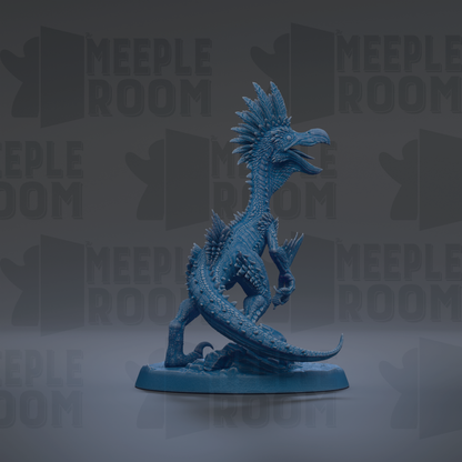 A blue, spiky figurine of a dinosaur-like creature with sharp teeth and claws, standing on a base.