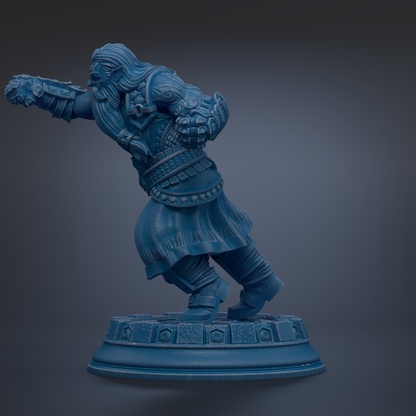 A blue statue of a warrior figure with a sword and shield, standing on a pedestal.