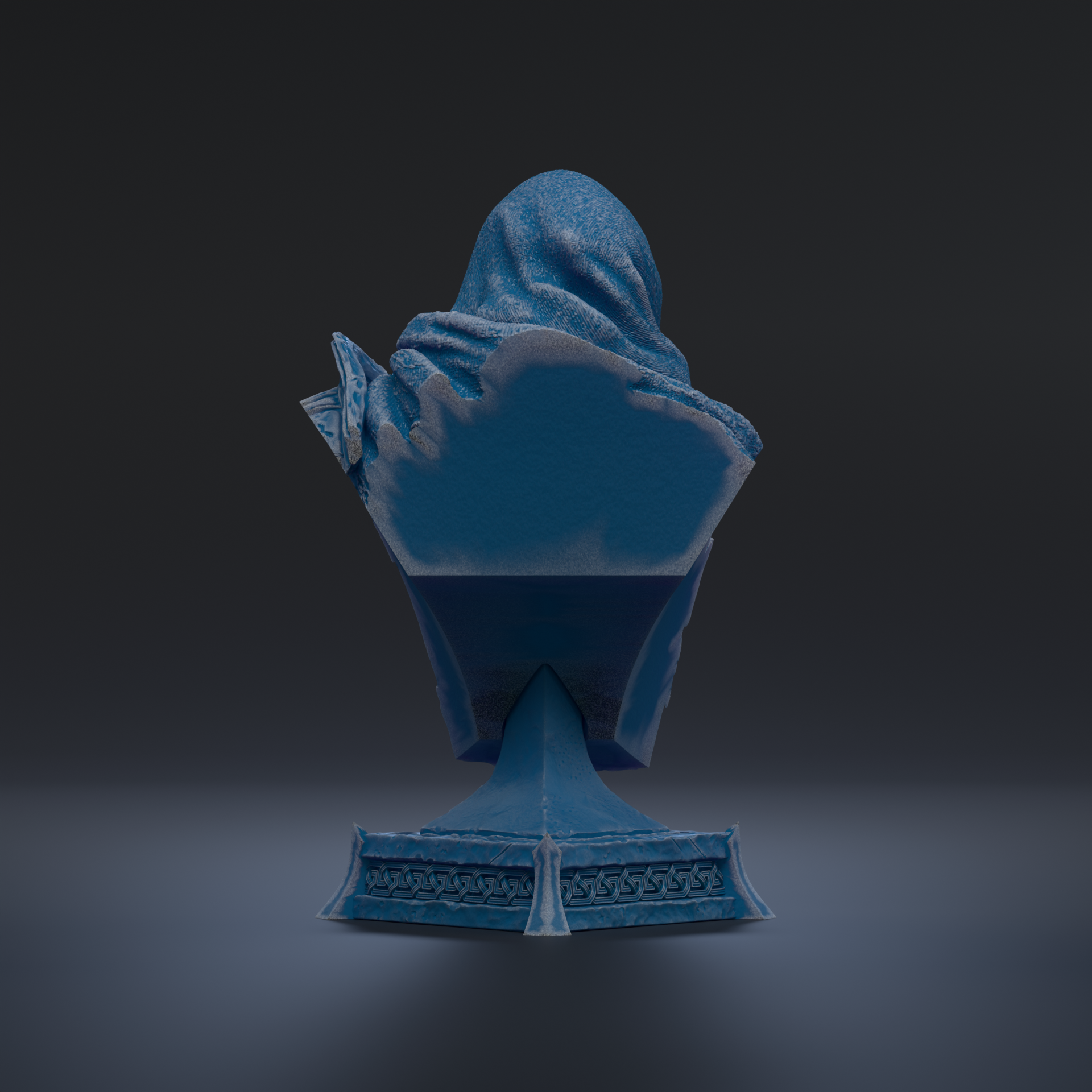 A blue statue of a person sitting on a pedestal against a dark background.