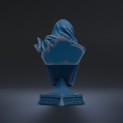 A blue statue of a person sitting on a pedestal against a dark background.