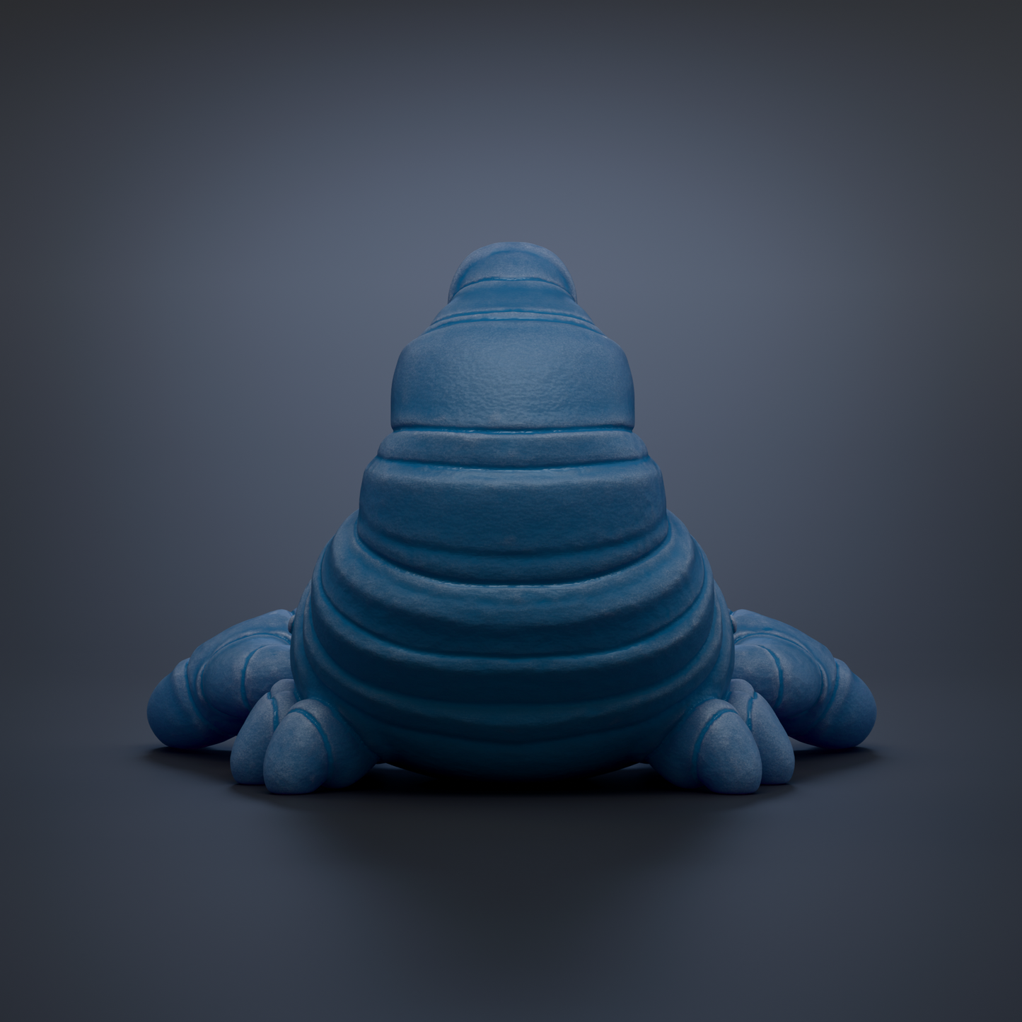 A blue, three-dimensional object resembling a small, elongated creature or shape, sitting on a dark background.