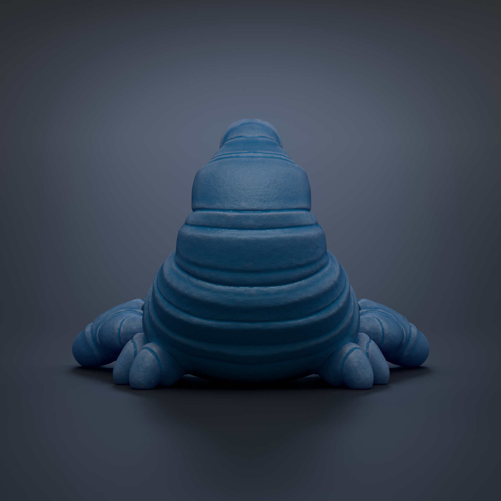 A blue, three-dimensional object resembling a small, elongated creature or shape, sitting on a dark background.