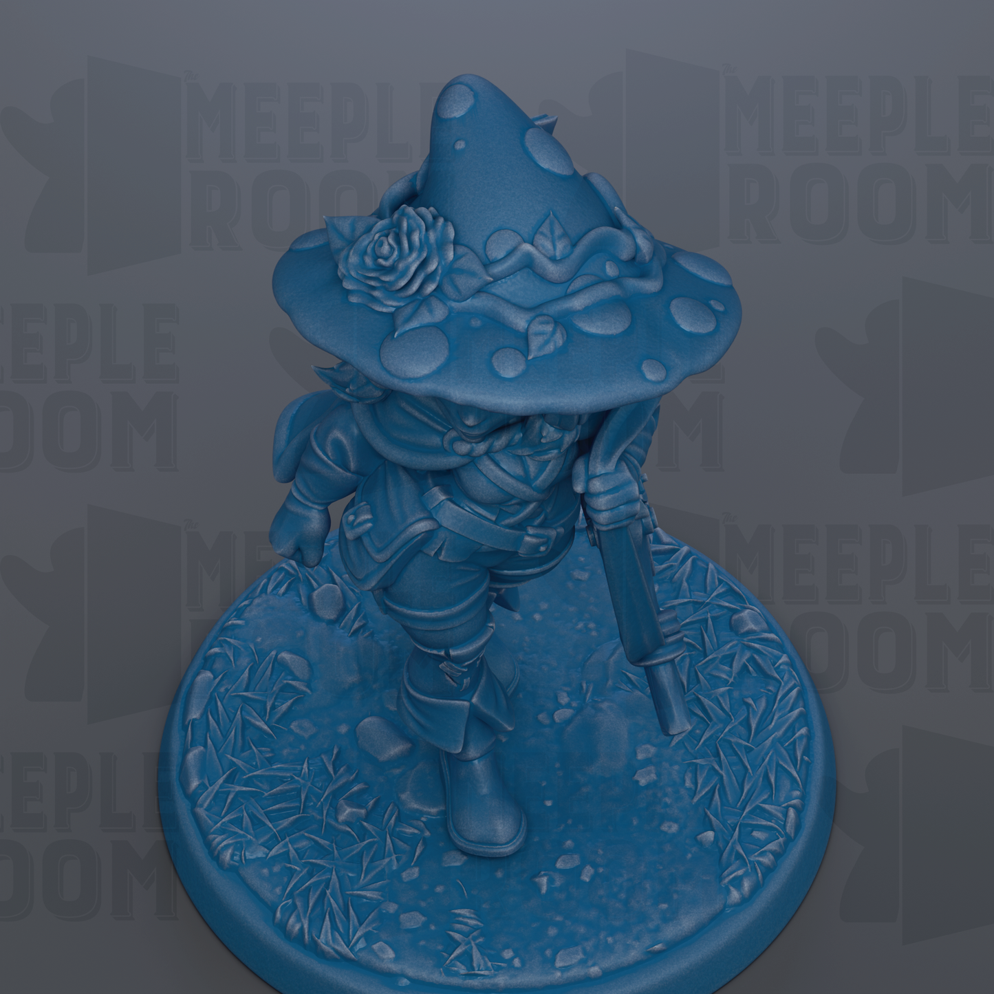 A blue figurine of a wizard or magical character, wearing a pointed hat with a rose, standing on a base with a leafy, textured surface.