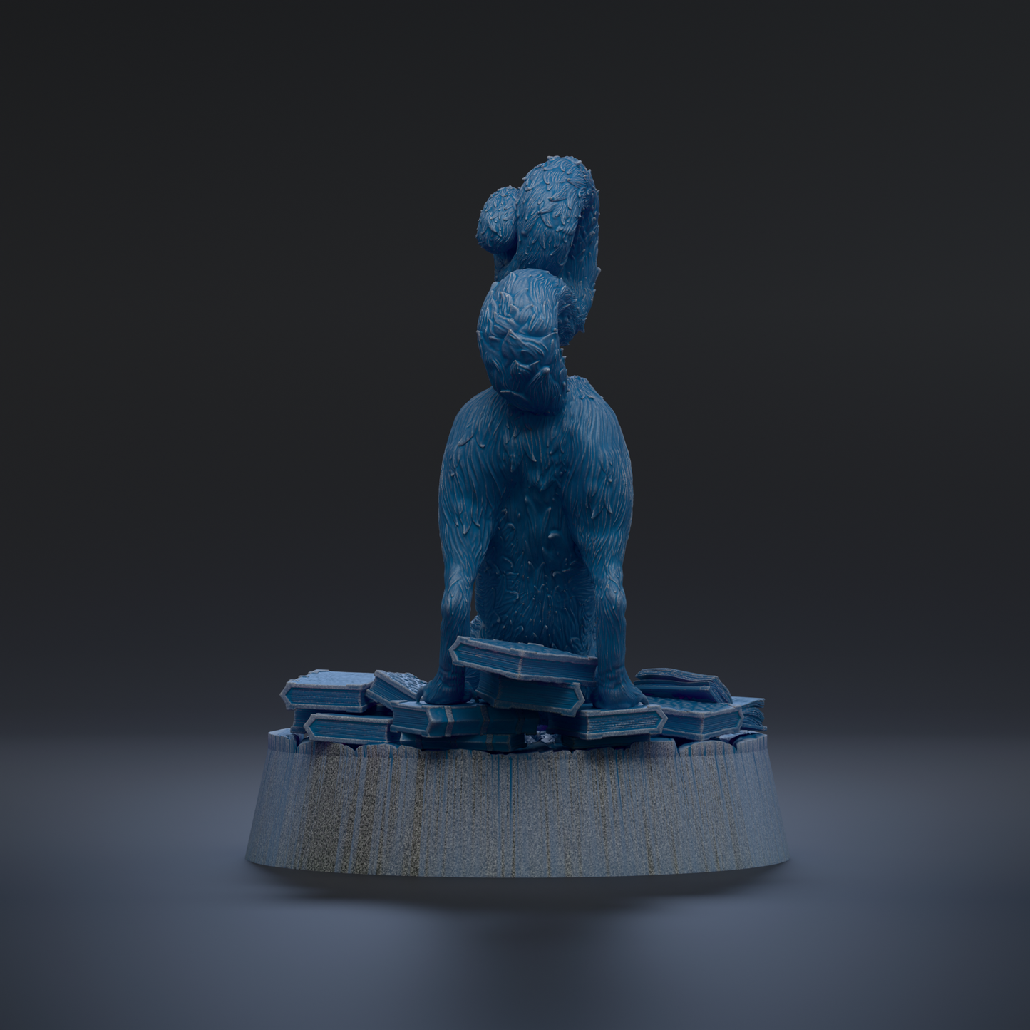 A blue, furry sculpture of a cat sitting on a pile of blue and white blocks, with a dark background.