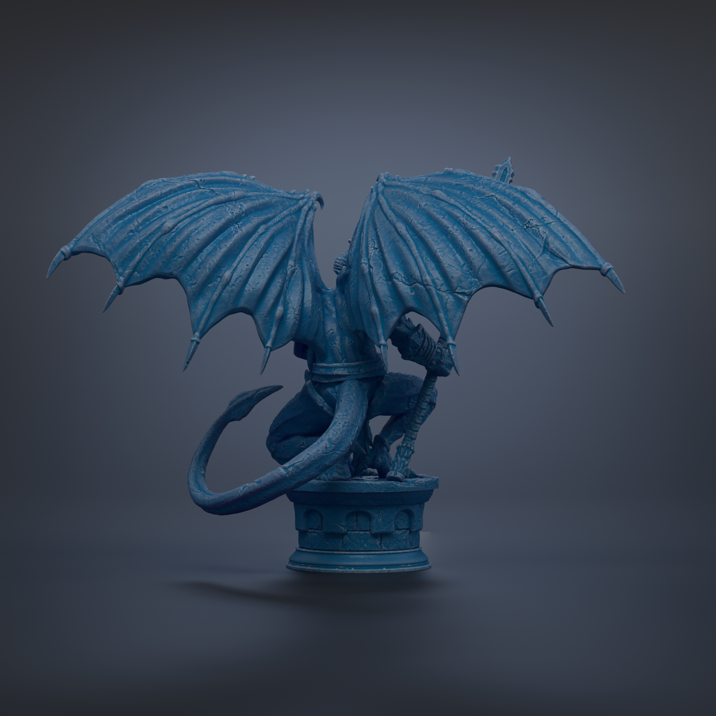 A blue dragon statue with outstretched wings and a curled tail, standing on a pedestal.