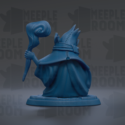 A blue figurine of a wizard or magical being holding a staff and standing on a pedestal.