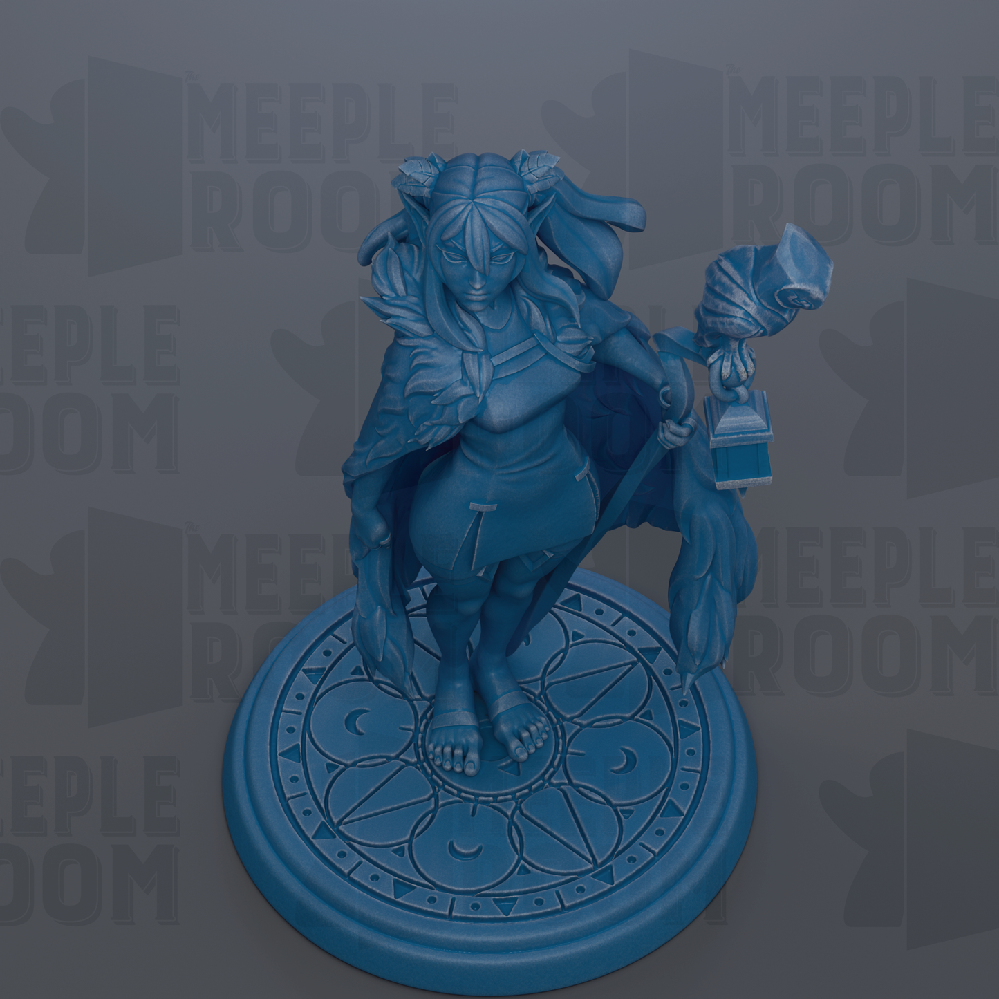 A blue figurine of a woman with a long, flowing skirt and a headdress, standing on a circular base with a geometric pattern.