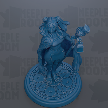 A blue figurine of a woman with a long, flowing skirt and a headdress, standing on a circular base with a geometric pattern.