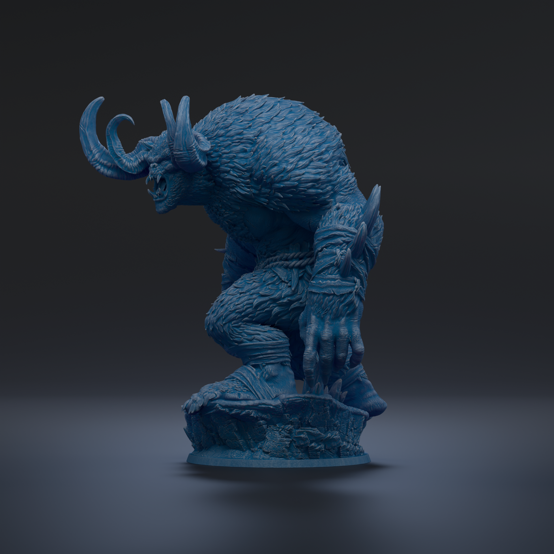 A blue, furry statue of a fierce-looking creature with horns and claws, standing on a rock.
