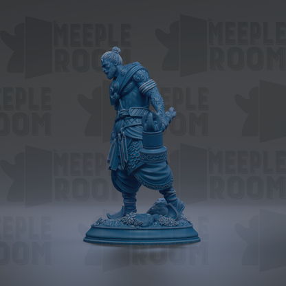 A blue statue of a warrior figure standing on a pedestal against a dark background.