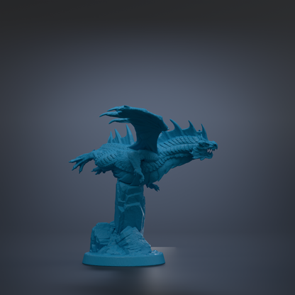 A blue dragon statue with wings spread, standing on a rock formation against a dark background.