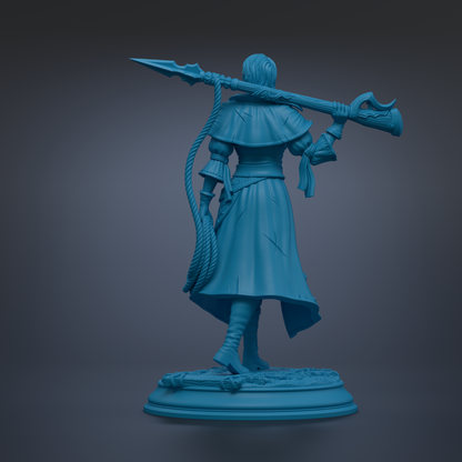 A blue statue of a person holding a spear and a rope.