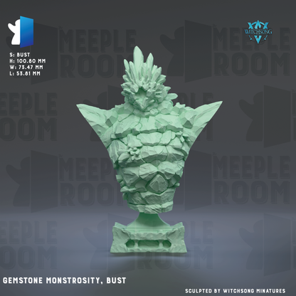 a bust sculpture of a green gemstone monster with a large head and sharp teeth, set against a dark background with repeated text.