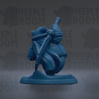 A blue figurine of a character with a sword and shield, standing on a base.
