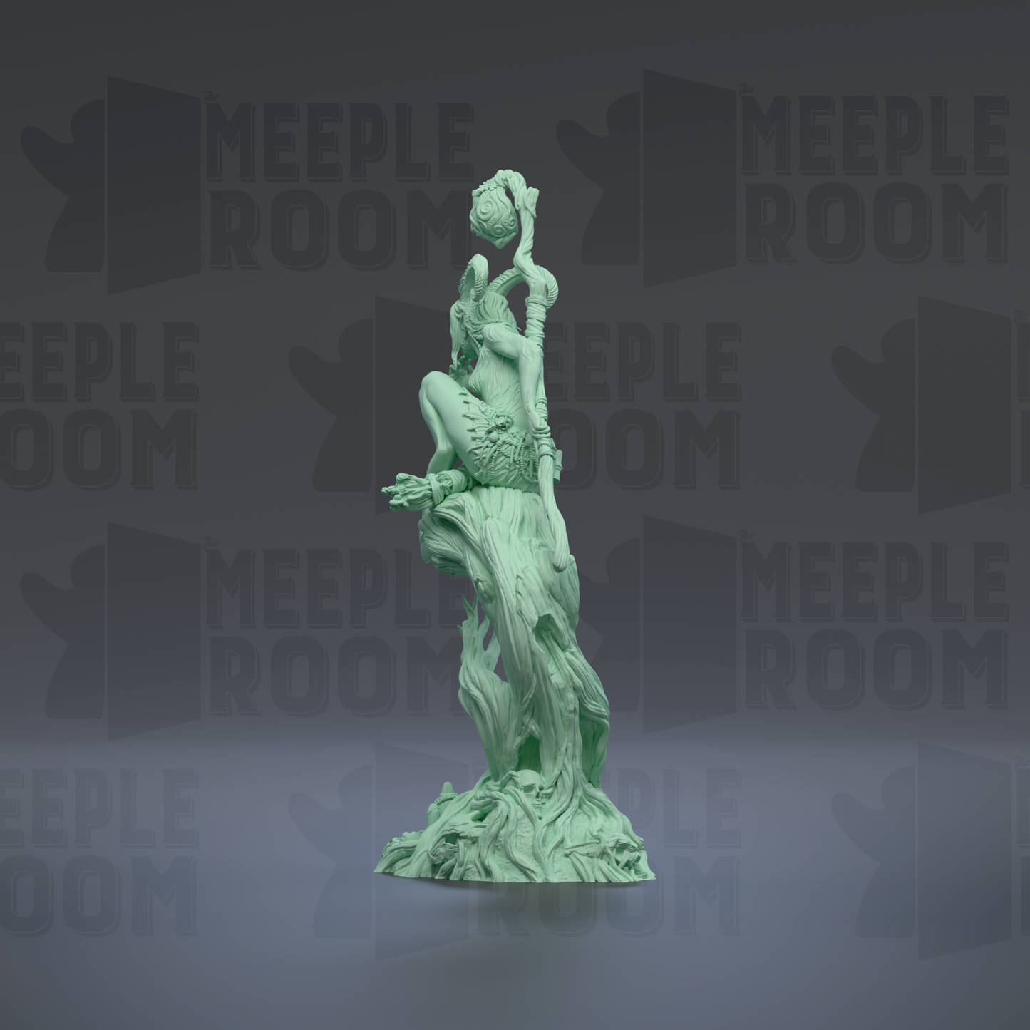 A green statue of a figure holding a staff and a ball, standing on a rock formation.
