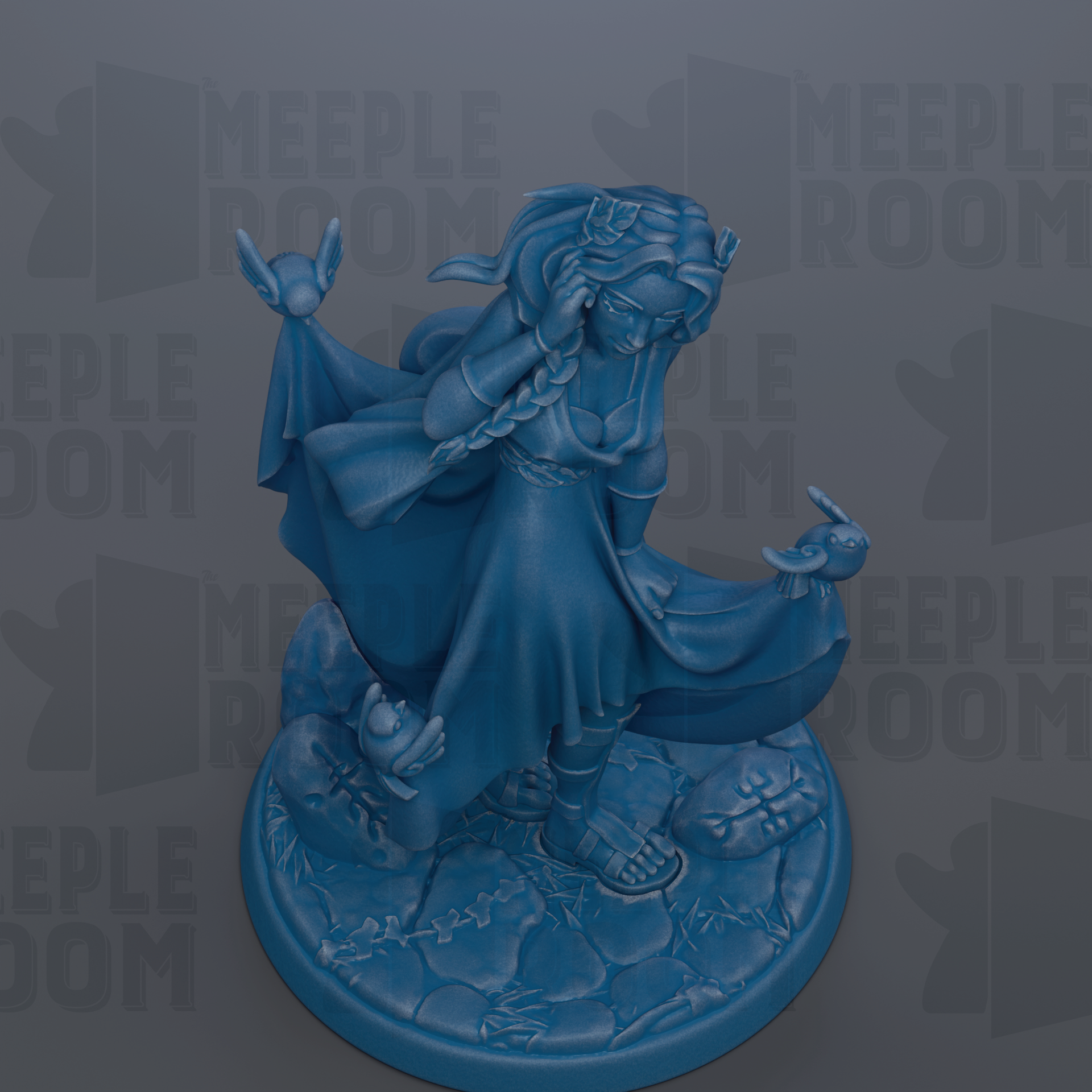 A blue figurine of a woman with long hair and a flowing dress, holding a bird in her hand, standing on a rock formation.