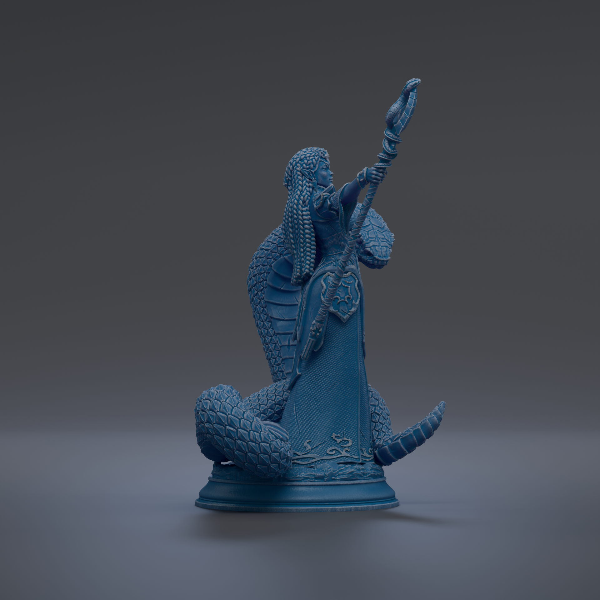 A blue statue of a figure holding a staff and a snake.