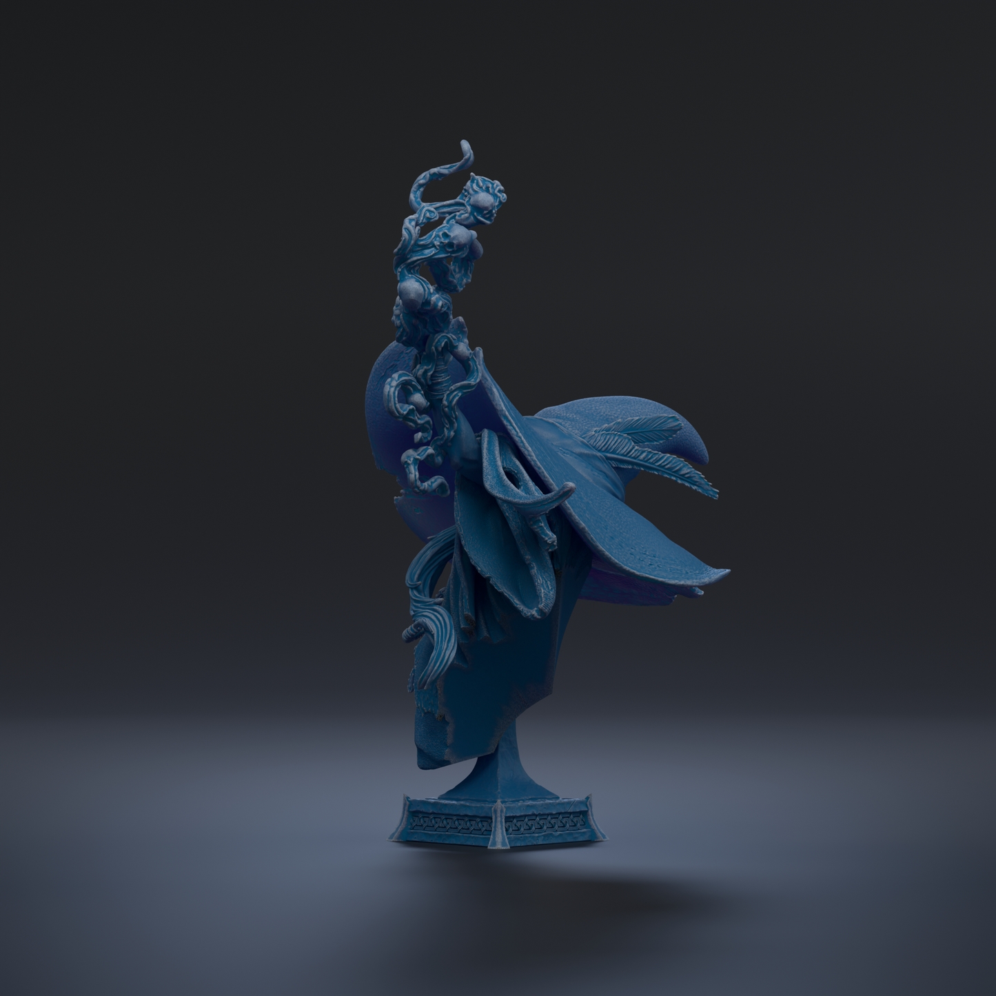 A blue, fantastical statue of a dragon-like creature with intricate, flowing designs and a large head.