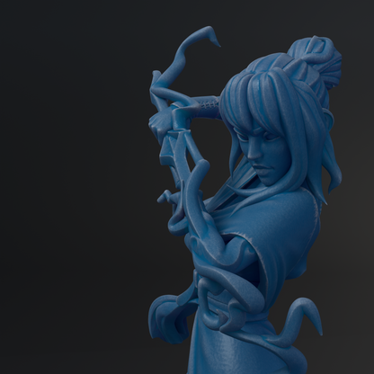 A blue, abstract sculpture depicting a figure with flowing, organic shapes and lines.