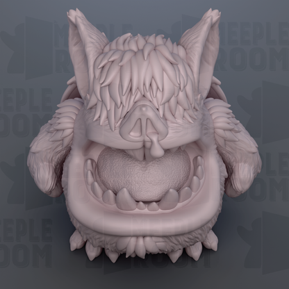 A close-up view of a detailed, textured sculpture depicting a large, furry creature with sharp teeth and an open mouth.