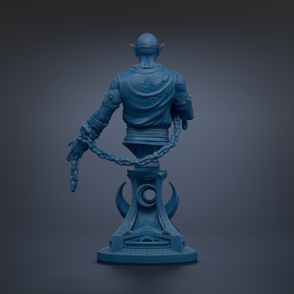 A blue statue of a man with a chain around his neck, standing on a pedestal.