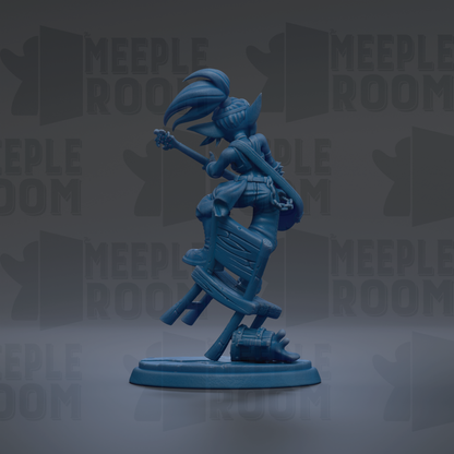 A blue figurine of a person playing a guitar, standing on a platform.